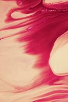 Abstract created using the technique of liquid acrylic. Macro photography of the smallest details of a panting. The panting shows how overflows of shades and colors of paint resemble space motifs. photo