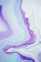 Abstract created using the technique of liquid acrylic. Macro photography of the smallest details of a panting. The panting shows how overflows of shades and colors of paint resemble space motifs. photo