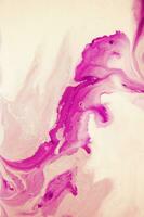 Abstract created using the technique of liquid acrylic. Macro photography of the smallest details of a panting. The panting shows how overflows of shades and colors of paint resemble space motifs. photo