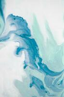 Abstract created using the technique of liquid acrylic. Macro photography of the smallest details of a panting. The panting shows how overflows of shades and colors of paint resemble space motifs. photo