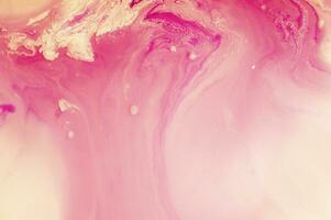 Abstract created using the technique of liquid acrylic. Macro photography of the smallest details of a panting. The panting shows how overflows of shades and colors of paint resemble space motifs. photo