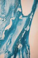 Abstract created using the technique of liquid acrylic. Macro photography of the smallest details of a picture. The picture shows how overflows of shades and colors of paint resemble space motifs. photo