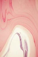 Abstract created using the technique of liquid acrylic. Macro photography of the smallest details of a picture. The picture shows how overflows of shades and colors of paint resemble space motifs. photo