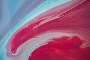 Abstract created using the technique of liquid acrylic. Macro photography of the smallest details of a panting. The panting shows how overflows of shades and colors of paint resemble space motifs. photo