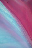 Abstract created using the technique of liquid acrylic. Macro photography of the smallest details of a panting. The panting shows how overflows of shades and colors of paint resemble space motifs. photo