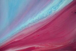 Abstract created using the technique of liquid acrylic. Macro photography of the smallest details of a panting. The panting shows how overflows of shades and colors of paint resemble space motifs. photo