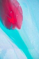 Abstract created using the technique of liquid acrylic. Macro photography of the smallest details of a panting. The panting shows how overflows of shades and colors of paint resemble space motifs. photo