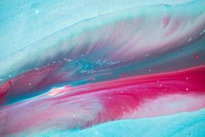 Abstract created using the technique of liquid acrylic. Macro photography of the smallest details of a panting. The panting shows how overflows of shades and colors of paint resemble space motifs. photo