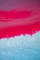 Abstract created using the technique of liquid acrylic. Macro photography of the smallest details of a panting. The panting shows how overflows of shades and colors of paint resemble space motifs. photo