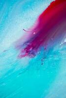 Abstract created using the technique of liquid acrylic. Macro photography of the smallest details of a panting. The panting shows how overflows of shades and colors of paint resemble space motifs. photo