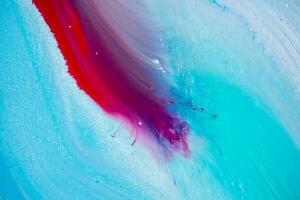 Abstract created using the technique of liquid acrylic. Macro photography of the smallest details of a panting. The panting shows how overflows of shades and colors of paint resemble space motifs. photo