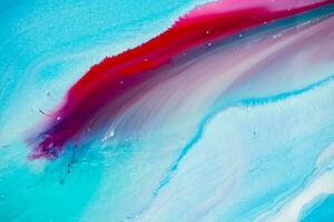 Abstract created using the technique of liquid acrylic. Macro photography of the smallest details of a panting. The panting shows how overflows of shades and colors of paint resemble space motifs. photo