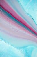 Abstract created using the technique of liquid acrylic. Macro photography of the smallest details of a panting. The panting shows how overflows of shades and colors of paint resemble space motifs. photo
