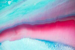 Abstract created using the technique of liquid acrylic. Macro photography of the smallest details of a panting. The panting shows how overflows of shades and colors of paint resemble space motifs. photo