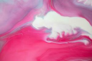 Abstract created using the technique of liquid acrylic. Macro photography of the smallest details of a panting. The panting shows how overflows of shades and colors of paint resemble space motifs. photo