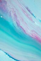 Abstract created using the technique of liquid acrylic. Macro photography of the smallest details of a panting. The panting shows how overflows of shades and colors of paint resemble space motifs. photo