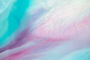 Abstract created using the technique of liquid acrylic. Macro photography of the smallest details of a panting. The panting shows how overflows of shades and colors of paint resemble space motifs. photo