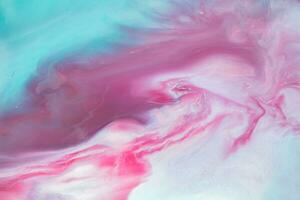 Abstract created using the technique of liquid acrylic. Macro photography of the smallest details of a panting. The panting shows how overflows of shades and colors of paint resemble space motifs. photo