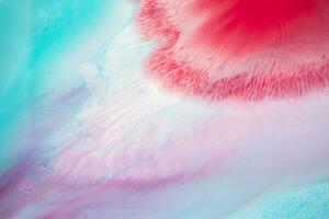 Abstract created using the technique of liquid acrylic. Macro photography of the smallest details of a panting. The panting shows how overflows of shades and colors of paint resemble space motifs. photo