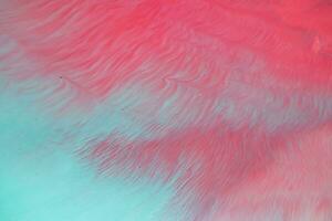 Abstract created using the technique of liquid acrylic. Macro photography of the smallest details of a panting. The panting shows how overflows of shades and colors of paint resemble space motifs. photo