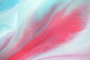 Abstract created using the technique of liquid acrylic. Macro photography of the smallest details of a panting. The panting shows how overflows of shades and colors of paint resemble space motifs. photo