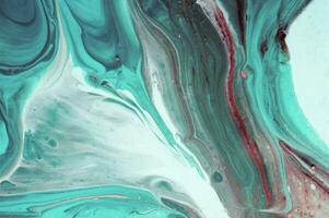 Abstract created using the technique of liquid acrylic. Macro photography of the smallest details of a panting. The panting shows how overflows of shades and colors of paint resemble space motifs. photo
