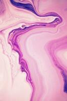Abstract created using the technique of liquid acrylic. Macro photography of the smallest details of a panting. The panting shows how overflows of shades and colors of paint resemble space motifs. photo