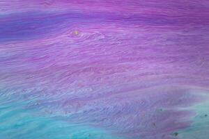 Abstract created using the technique of liquid acrylic. Macro photography of the smallest details of a picture. The picture shows how overflows of shades and colors of paint resemble space motifs. photo