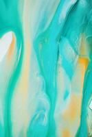 Abstract created using the technique of liquid acrylic. Macro photography of the smallest details of a picture. The picture shows how overflows of shades and colors of paint resemble space motifs. photo