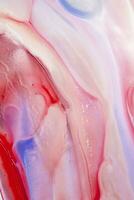 Abstract created using the technique of liquid acrylic. Macro photography of the smallest details of a picture. The picture shows how overflows of shades and colors of paint resemble space motifs. photo
