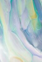 Abstract created using the technique of liquid acrylic. Macro photography of the smallest details of a picture. The picture shows how overflows of shades and colors of paint resemble space motifs. photo