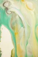 Abstract created using the technique of liquid acrylic. Macro photography of the smallest details of a picture. The picture shows how overflows of shades and colors of paint resemble space motifs. photo
