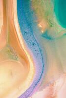 Abstract created using the technique of liquid acrylic. Macro photography of the smallest details of a picture. The picture shows how overflows of shades and colors of paint resemble space motifs. photo