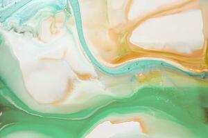 Abstract created using the technique of liquid acrylic. Macro photography of the smallest details of a picture. The picture shows how overflows of shades and colors of paint resemble space motifs. photo