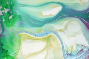 Abstract created using the technique of liquid acrylic. Macro photography of the smallest details of a picture. The picture shows how overflows of shades and colors of paint resemble space motifs. photo