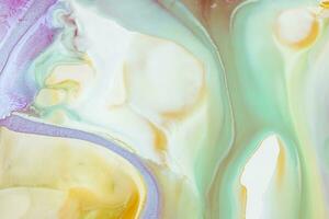 Abstract created using the technique of liquid acrylic. Macro photography of the smallest details of a picture. The picture shows how overflows of shades and colors of paint resemble space motifs. photo