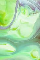 Abstract created using the technique of liquid acrylic. Macro photography of the smallest details of a picture. The picture shows how overflows of shades and colors of paint resemble space motifs. photo