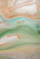 Abstract created using the technique of liquid acrylic. Macro photography of the smallest details of a picture. The picture shows how overflows of shades and colors of paint resemble space motifs. photo
