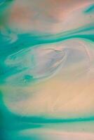 Abstract created using the technique of liquid acrylic. Macro photography of the smallest details of a picture. The picture shows how overflows of shades and colors of paint resemble space motifs. photo