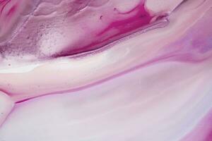 Abstract created using the technique of liquid acrylic. Macro photography of the smallest details of a picture. The picture shows how overflows of shades and colors of paint resemble space motifs. photo