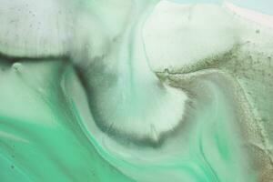 Abstract created using the technique of liquid acrylic. Macro photography of the smallest details of a picture. The picture shows how overflows of shades and colors of paint resemble space motifs. photo