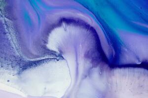 Abstract created using the technique of liquid acrylic. Macro photography of the smallest details of a picture. The picture shows how overflows of shades and colors of paint resemble space motifs. photo