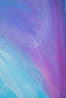 Abstract created using the technique of liquid acrylic. Macro photography of the smallest details of a panting. The panting shows how overflows of shades and colors of paint resemble space motifs. photo