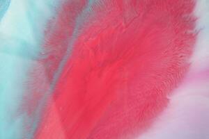 Abstract created using the technique of liquid acrylic. Macro photography of the smallest details of a panting. The panting shows how overflows of shades and colors of paint resemble space motifs. photo