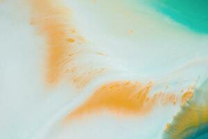 Abstract created using the technique of liquid acrylic. Macro photography of the smallest details of a picture. The picture shows how overflows of shades and colors of paint resemble space motifs. photo