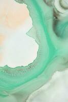 Abstract created using the technique of liquid acrylic. Macro photography of the smallest details of a picture. The picture shows how overflows of shades and colors of paint resemble space motifs. photo
