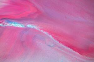 Abstract created using the technique of liquid acrylic. Macro photography of the smallest details of a panting. The panting shows how overflows of shades and colors of paint resemble space motifs. photo