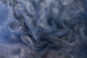 Abstract fluid acrylic painting. Marbled blue and gold abstract Ink cloud on background. Liquid marble pattern. Modern art. photo
