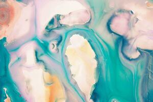 Abstract created using the technique of liquid acrylic. Macro photography of the smallest details of a picture. The picture shows how overflows of shades and colors of paint resemble space motifs. photo