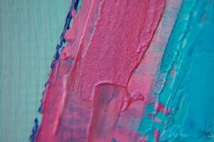 Fragment. Multicolored texture painting. Abstract art background. oil on canvas. Rough brushstrokes of paint. Closeup of a painting by oil and palette knife. Highly-textured, high quality details. photo